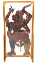 An eastern silk embroidery, of the puppeteer shadow puppets, in ply frame, 152cm high, 76cm wide, an