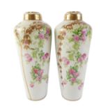 A pair of Royal Vienna Art Nouveau style vases, printed with flowers, and with gilt leaves, 25cm hig