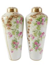 A pair of Royal Vienna Art Nouveau style vases, printed with flowers, and with gilt leaves, 25cm hig