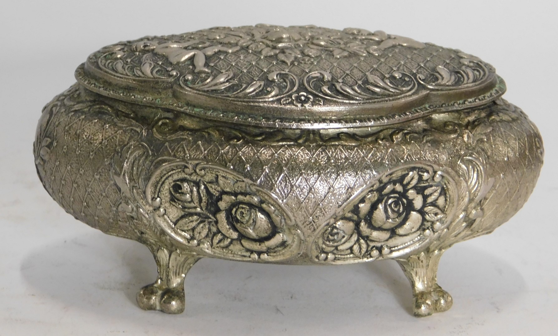 An Eastern silver plated jewellery casket, of shaped oval form with raised scroll decoration, with f - Image 2 of 3