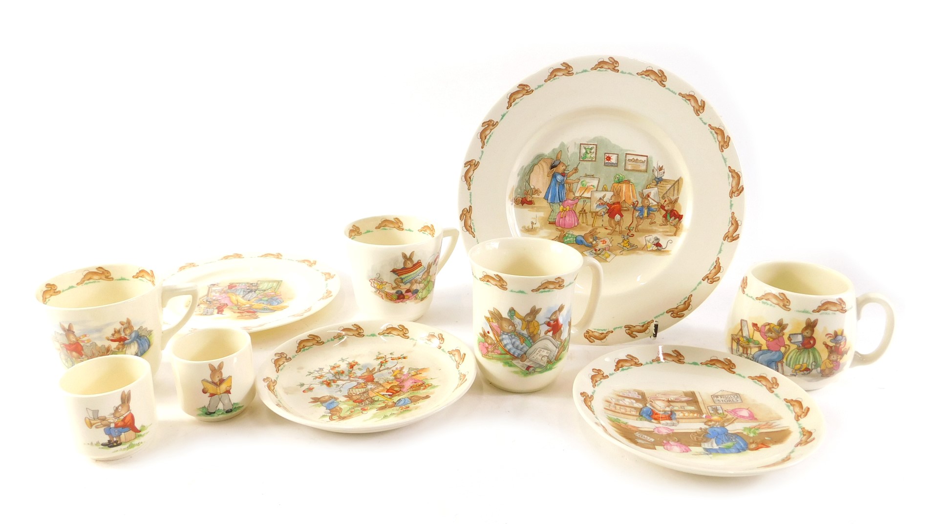 A group of Royal Doulton Bunnykins, comprising two breakfast cups, egg cup, child's cup, plate, bowl