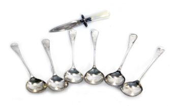 A set of six George V silver fiddle pattern tea spoons, maker AJB, Birmingham 1933, and a white meta