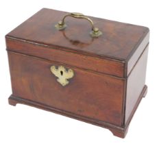 A George III mahogany tea caddy, the hinged top with a brass handle enclosing three divisions to the