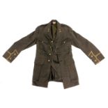 A green Army dress jacket, with applique and military buttons.