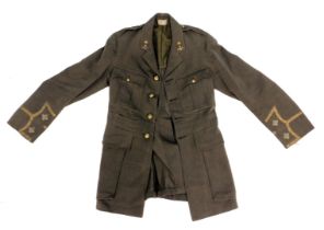 A green Army dress jacket, with applique and military buttons.