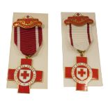 A British Red Cross Society enamel nurse's badge, and a first aid Red Cross badge, boxed. (2)