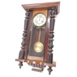 A Vienna wall clock, in walnut case, 77cm high. (AF)