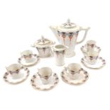 A Limoges Legrand & Co Art Deco coffee service, each piece decorated with arches in grey, black and