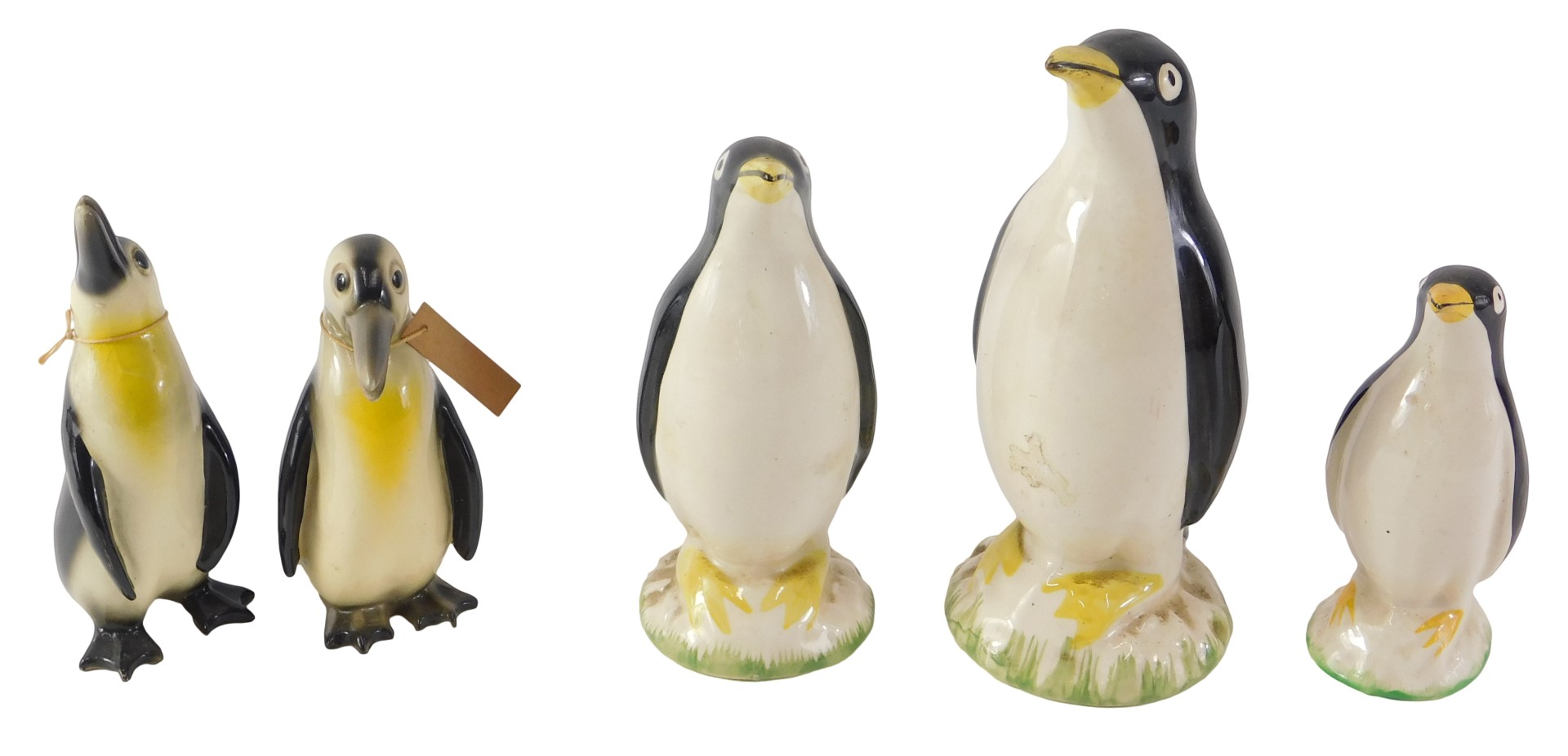 A graduated set of three Carlton ceramic penguins, and two 19thC ceramic penguins, the largest 15cm