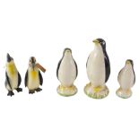 A graduated set of three Carlton ceramic penguins, and two 19thC ceramic penguins, the largest 15cm