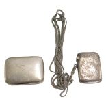 An Edward VII silver Vesta case, with scroll decoration, Birmingham 1907, on plated chain, and a sou