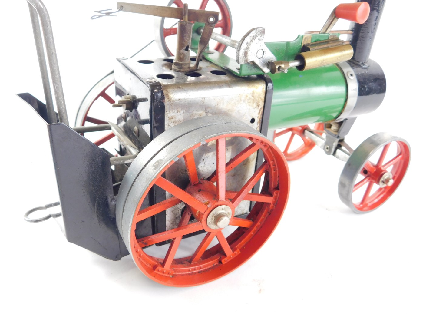 A Mamod model traction engine, painted in typical green, black and red livery, 26cm wide. - Image 3 of 4