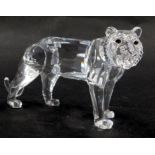A Swarovski crystal lion roaring, 7cm high, boxed, with display stand.