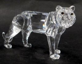 A Swarovski crystal lion roaring, 7cm high, boxed, with display stand.