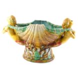 A 20thC majolica centrepiece, modelled in the form of two nude females either side of a clam shell,