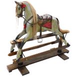 A dapple grey painted rocking horse, with leather saddle and bridle, etc., on an ash trestle base wi