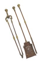 A set of 19thC brass and steel fire irons, comprising shovel, tongs and poker.