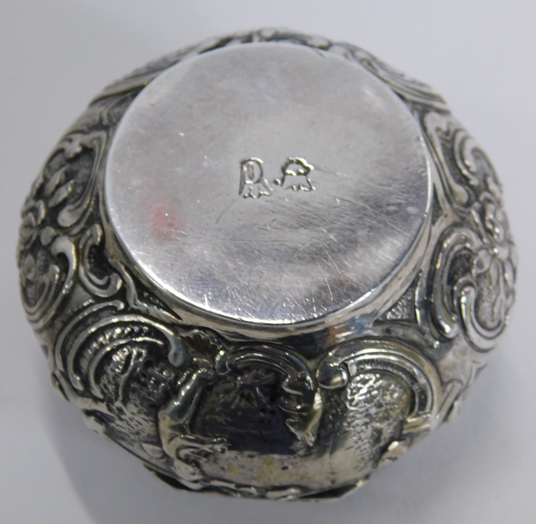 A Continental silver plated pill box, with embossed decoration of figures and animals on scroll deta - Image 3 of 4