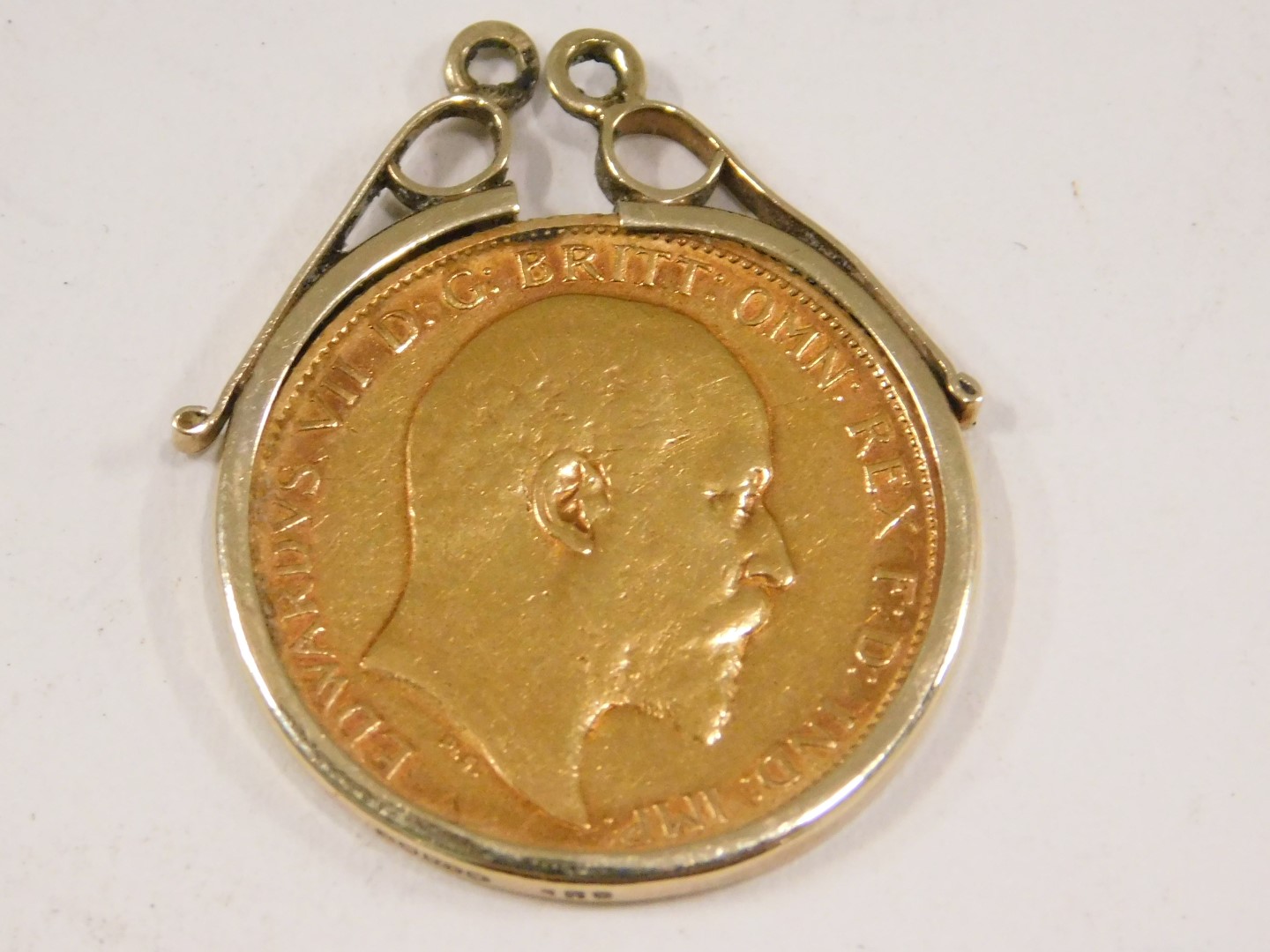 An Edward VII half gold sovereign, dated 1903, in a 9ct gold mount, 4.6g. - Image 2 of 3