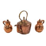 A Victorian copper kettle, and two copper Army and Navy Jersey type cream jugs.