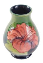 A Moorcroft freesia pattern miniature vase, 11cm high.