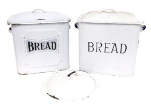 Two 20thC enamel rectangular bread bins, one plain cream, 30cm high, with lid, and another plain cre