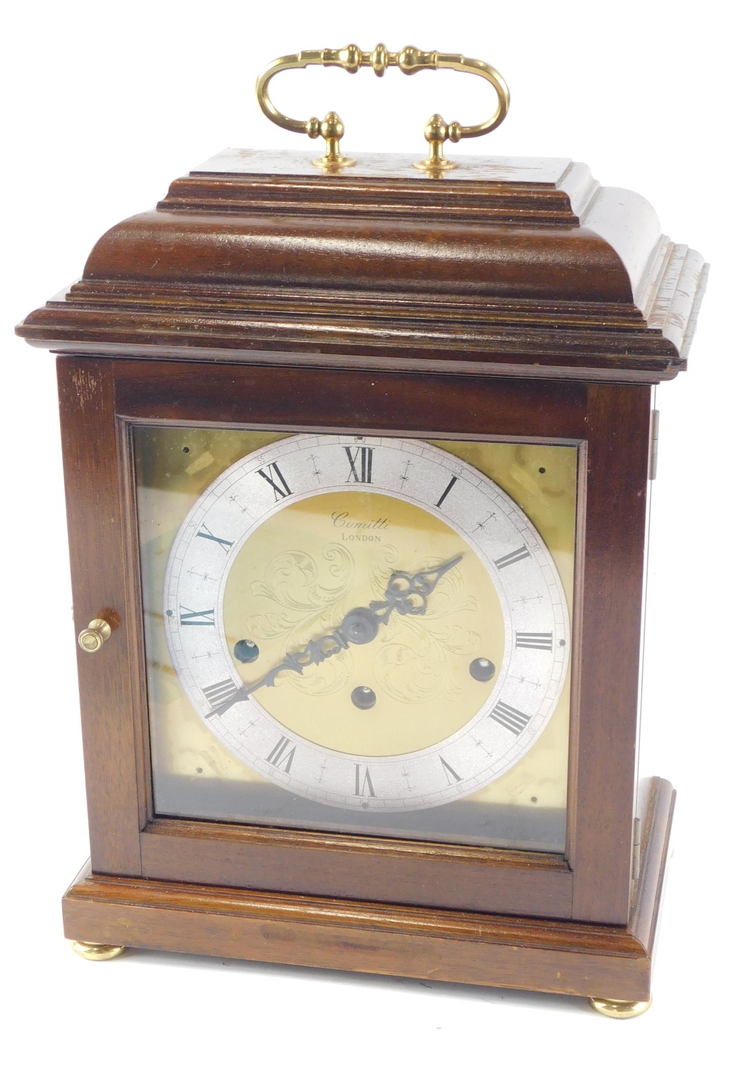 A Comitti mantel clock, with Westminster chime, and eight day movement, in a mahogany case, 35cm hig