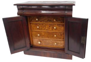 A Victorian miniature cabinet, the rectangular top with a moulded edge above a frieze drawer and two