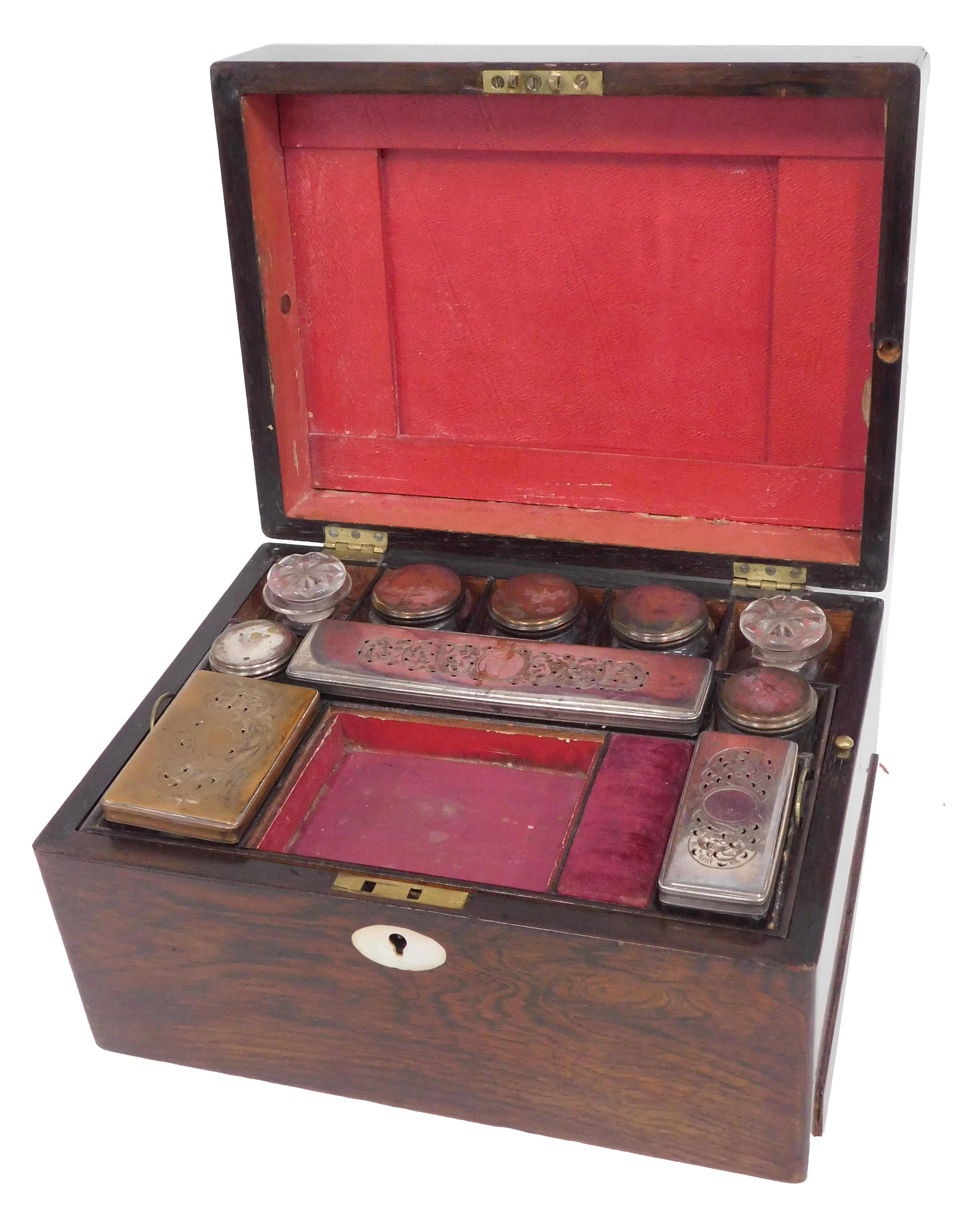 A Victorian rosewood dressing case, the hinged lid with vacant oval cartouche containing various gla