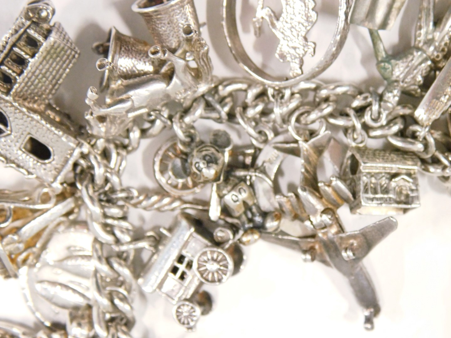 A silver charm bracelet, the curb link bracelet, with safety chain in heart shaped padlock, and vari - Image 3 of 3