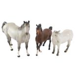 Three large ceramic horses, comprising a Branksome china grey horse, a large grey dapple Beswick hor