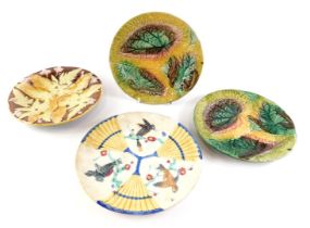 A collection of four various 19thC Majolica plates, various designs, to include leaves, etc.