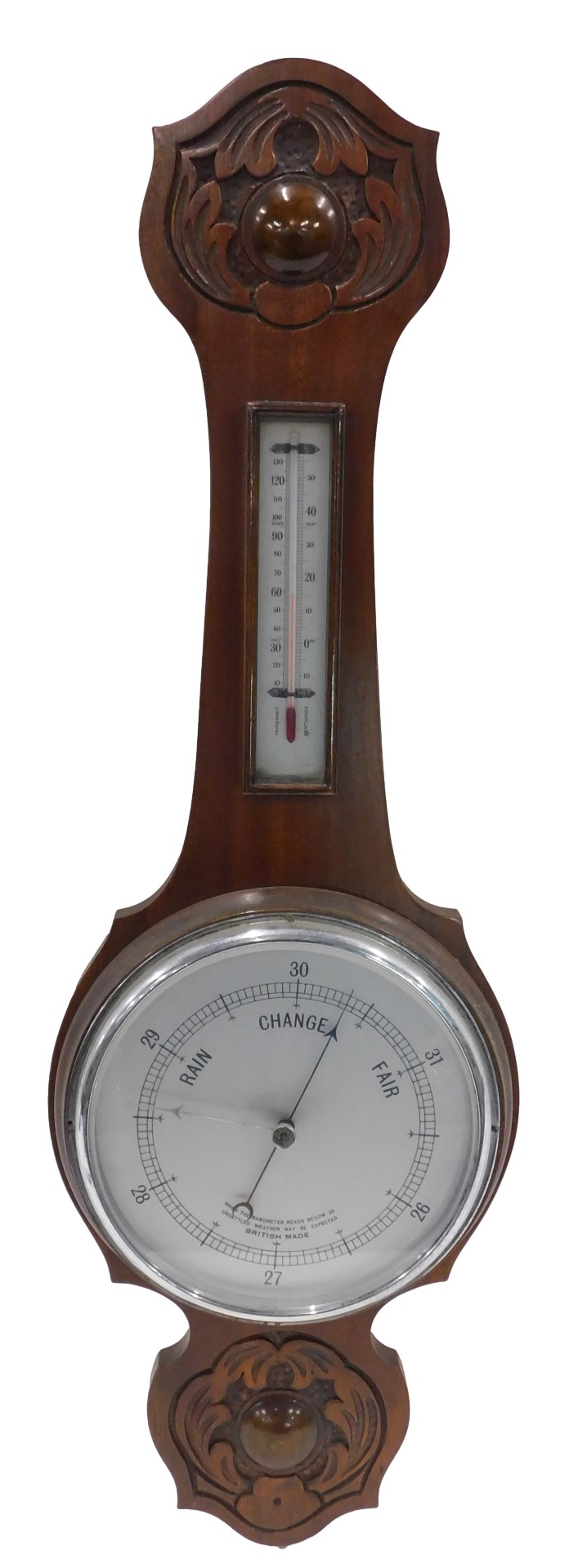 An Edwardian mahogany aneroid wheel shaped barometer with thermometer, in a carved case, 82cm high.