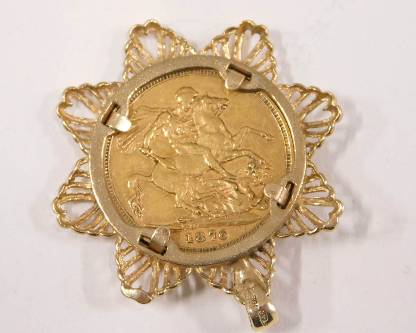 A young Victoria head full gold sovereign pendant, dated 1876, in a 9ct gold star mount, 12.3g all i - Image 2 of 3
