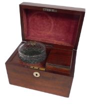 A 19thC mahogany tea caddy, with a boxed interior and cut glass bowl, with mother of pearl lock disk