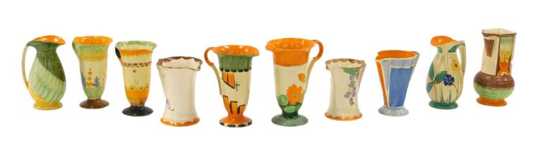 A collection of Myott Art Deco jugs, each decorated with flowers, etc.