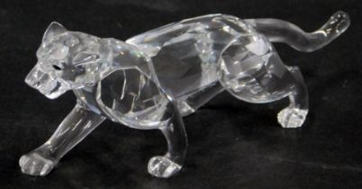 A Swarovski crystal figure of a cheetah, 12cm diameter, boxed.