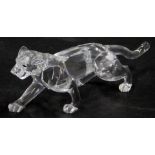 A Swarovski crystal figure of a cheetah, 12cm diameter, boxed.