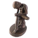 An Austin resin sculpture, of Spinario, or the boy seated with thorn, on oval base, 23cm high.