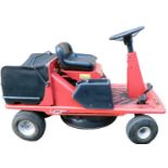 A Lawnflite 404 petrol ride on mower, in red.