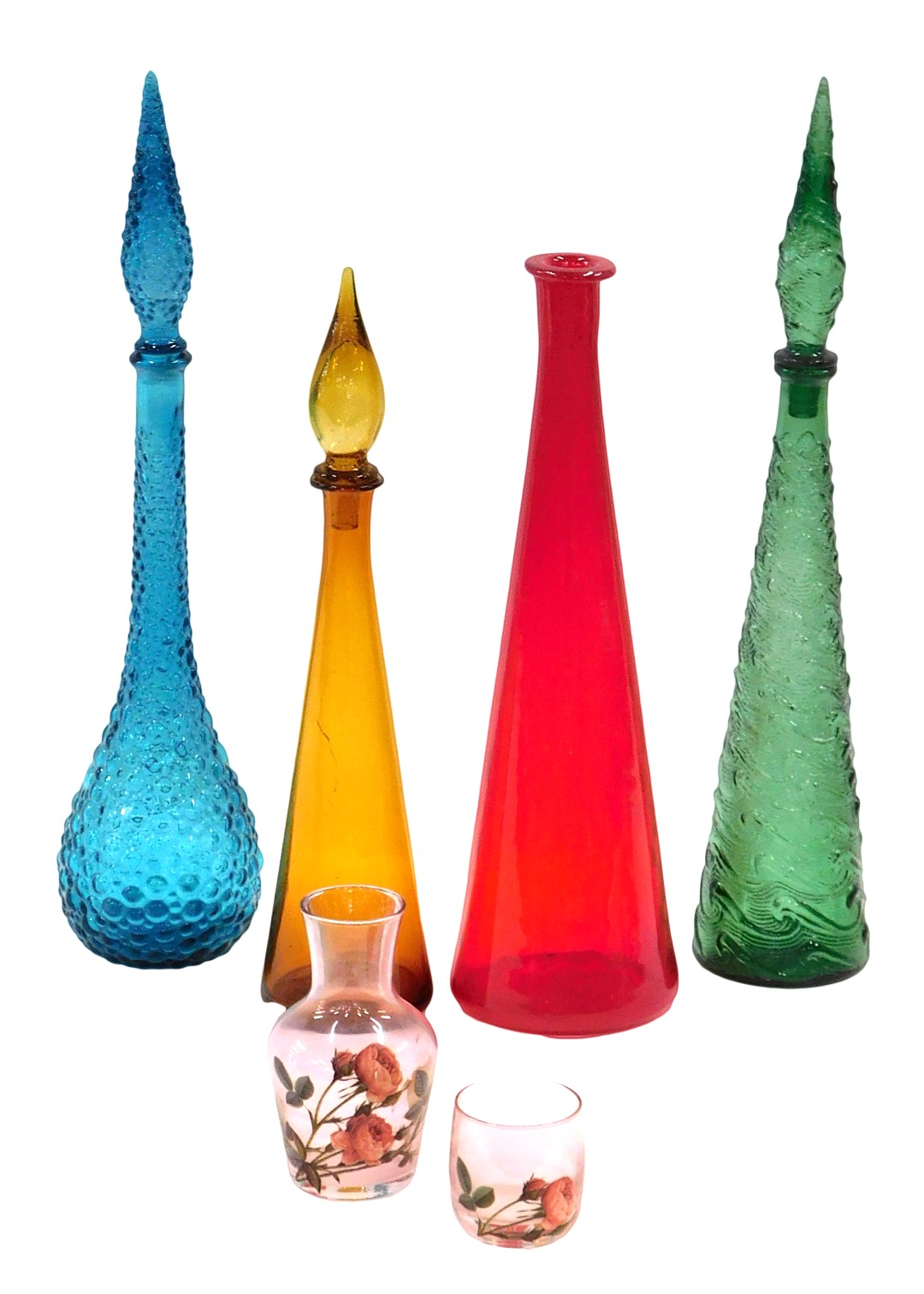 Four coloured glass pharmacist's type bottles, one lacking stopper, and a water jug with beaker.