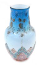 An Eastern cut glass vase, on a blue and pink floral painted ground, 28cm high.