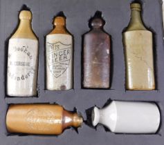 Six Victorian stoneware bottles, to include Idris ginger beer, M.Deehan Londonderry, and The Fortres