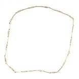 A fancy link neck chain with bar and twist breaks, yellow metal faint hallmarks to clasp, possibly 9