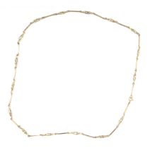 A fancy link neck chain with bar and twist breaks, yellow metal faint hallmarks to clasp, possibly 9