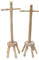 Two turned ash washing dollies.