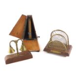 A French Maelzel metronome, in walnut case, a small brass letter rack, and a pair of horse bells. (3