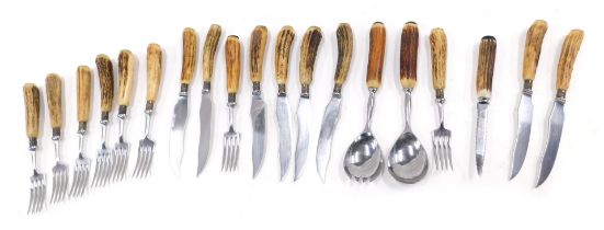 Various items of cutlery, each with simulated antler handles.