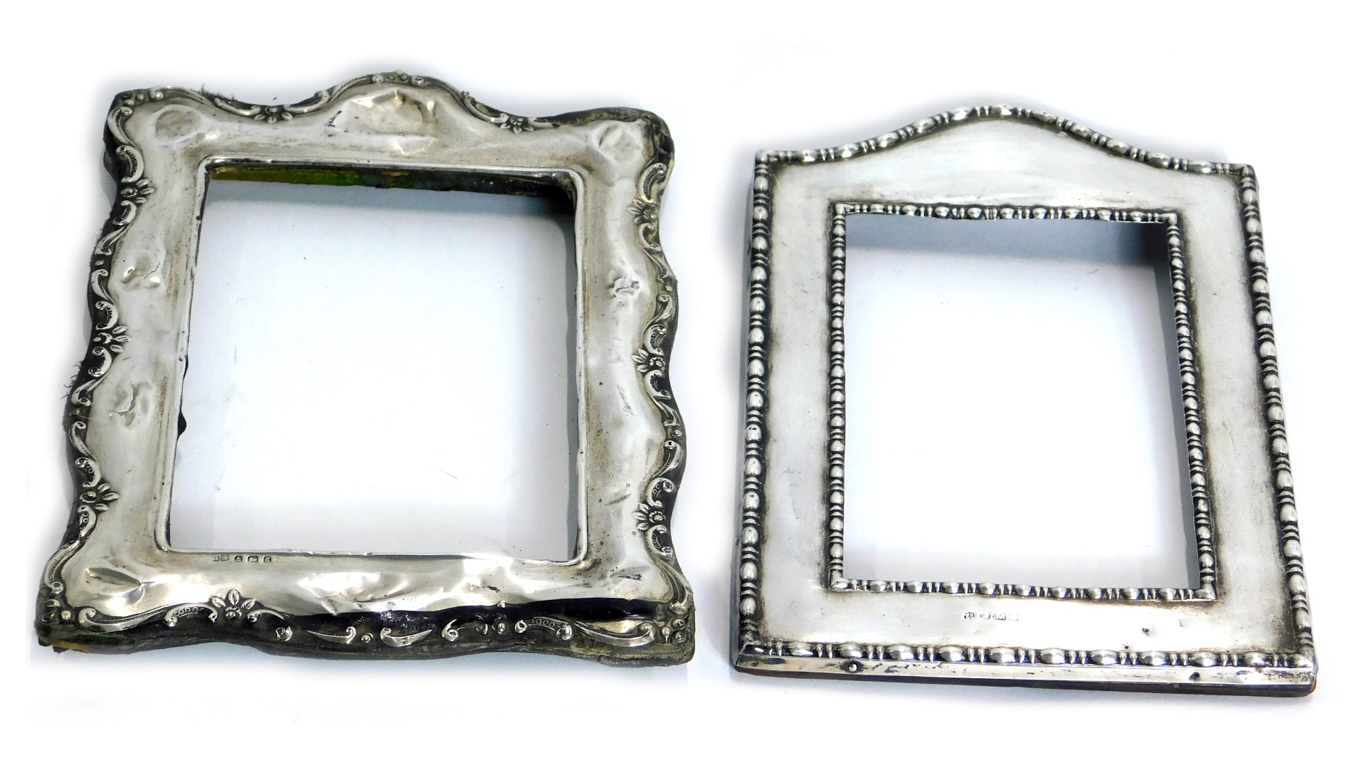 Two silver photograph frames, each on a wooden back. (2, AF)