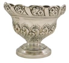 A Victorian silver bonbon dish, of fluted design, with rose border, on a stepped foot, Chester 1899,